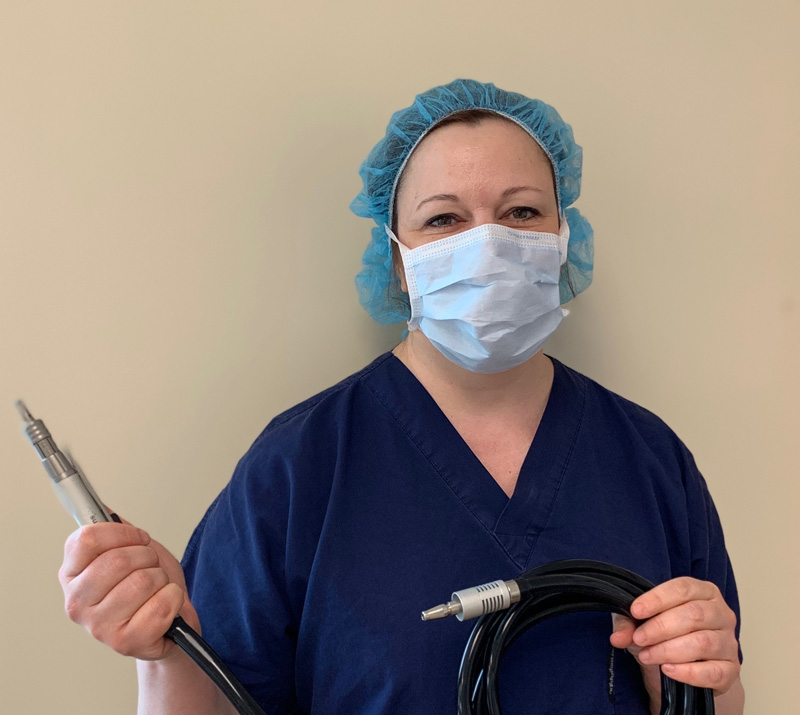 Debra Everts holds the new dental drill.